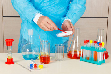 Chemist doing chemical experiments in the laboratory