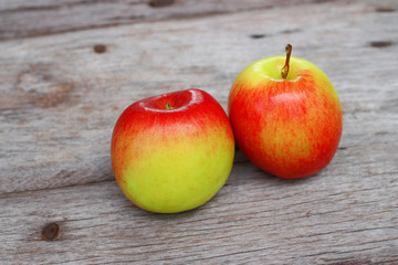 Red apple on wooden background 