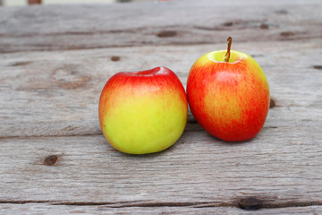 Red apple on wooden background 