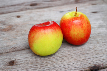 Red apple on wooden background 