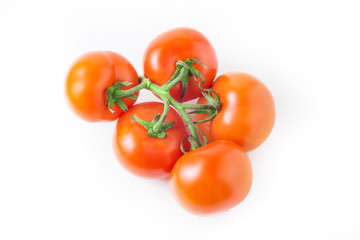 fresh tomatoes with green leaves isolated on white background