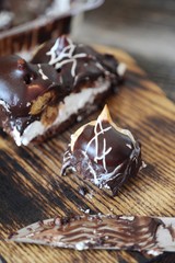 Delicious chocolate dessert with profiteroles and cream 