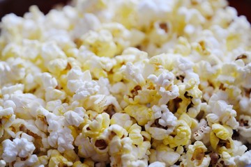 Fresh delicious popcorn with cheese close up