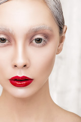 Fototapeta premium Fashion portrait of a girl with red lips. close-up