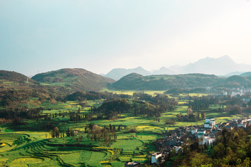 View on mountains and rapeseed fields in Yunnan