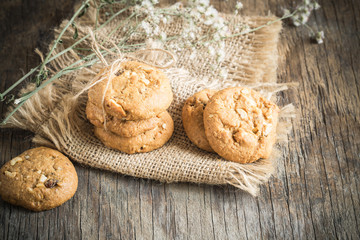 Homemade cookies on sackcloth on old wooden table