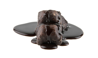 chocolate candy in liquid chocolate isolated on white background