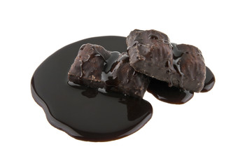 chocolate candy in liquid chocolate isolated on white background