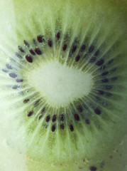 A glass of kiwi Juice with slices and fruits