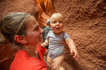 A mother and her baby son visit Lower Antelope canyon in Arizona © Maygutyak