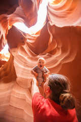 A mother and her baby son visit Lower Antelope canyon in Arizona