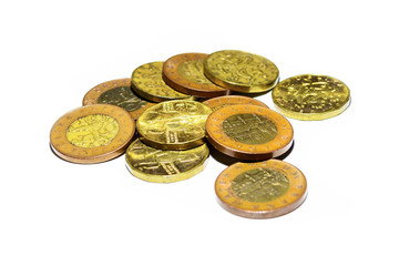 Czech gold coins on a white background. Detail of spent coins. Savings in small money. Payment in the Czech Republic. Financial savings in crowns.
