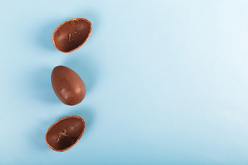 Chocolate eggs on blue background