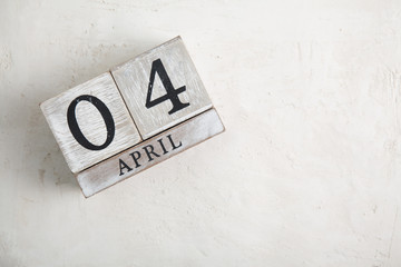 Block calendar on white background. 4 april