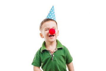 Boy in a festive cone and a clown's nose