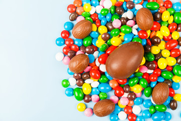Fototapeta na wymiar Chocolate eggs and color candy glaze