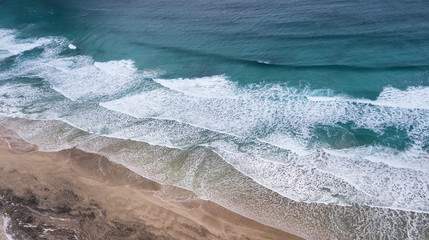 Wave on the beach as a background. Beautiful natural background at the summer time