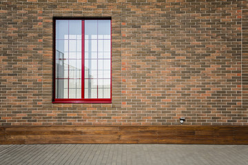 beautiful brick wall with window, basement decorated with wood