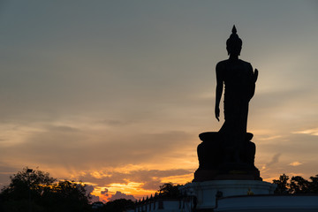 Silhouette large buddha in evening.