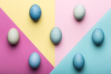 Happy Easter pastel coloured background. Hand painted Easter eggs abstract minimal concept.