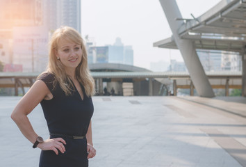 portrait of attractive business woman smile and happy at outdoor in modern city.