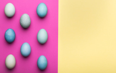 Happy Easter pastel coloured background. Hand painted Easter eggs abstract minimal concept.