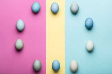 Happy Easter pastel coloured background. Hand painted Easter eggs abstract minimal concept.