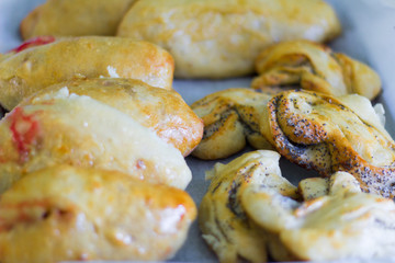 freshly baked homemade village cakes with viburnum and sweet buns with poppy seeds