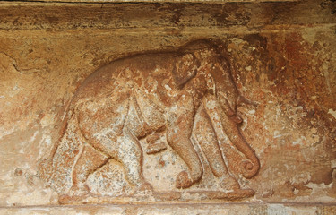Stone bas-reliefs on the walls the temple complex Hemakuta hill in Hampi, Karnataka, India.
