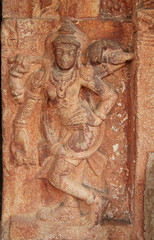 Stone bas-reliefs on the walls the temple complex Hemakuta hill in Hampi, Karnataka, India.