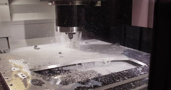Close-up of a water jet metal cutting machine in slow motion