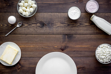 Breakfast on farm with dairy products. Milk, cottage, cheese, yougurt on wooden table top view mock-up