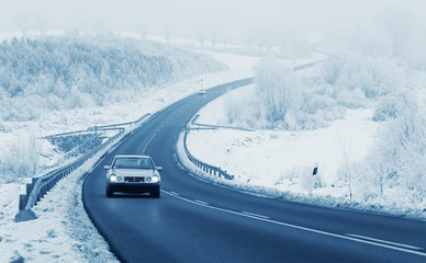 Fototapeta na wymiar Car on road in winter