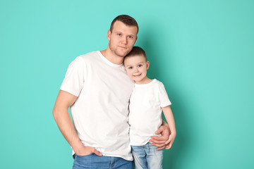 Dad and his son on color background. Father's day celebration