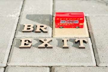  Britain exit from European Union, Brexit word abstract in vintage letters,background double decker bus toy model