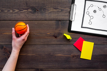 Sport judging concept. Basketball referee. Tactic plan for game, basketball ball, red and yellow...