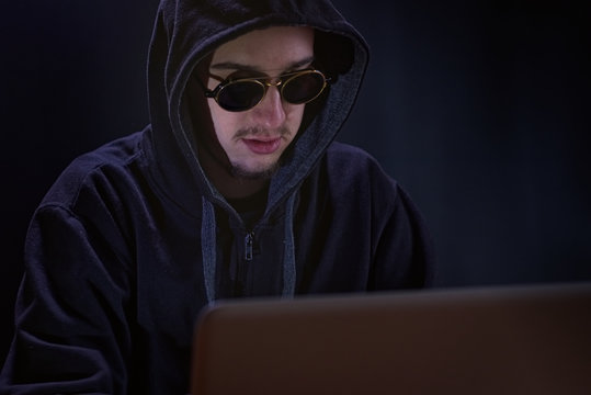 Hacker on black background