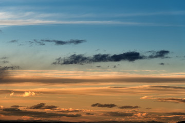 Fototapeta na wymiar Long wispy clouds over the desert of southern Idaho sunset
