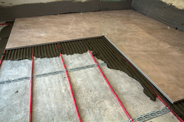 Ceramic tiles and tools for tiler. Floor tiles installation. Home improvement, renovation - ceramic...