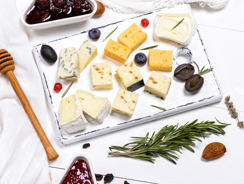small pieces of brie cheese, roquefort, camembert, cheddar