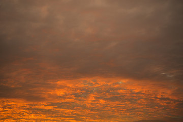 Crimson clouds at sunset. background.