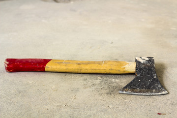 Old iron axe with wooden red and yellow handle isolated on white background. Handwork, labour and...
