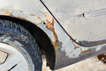 Rusty right wing covered with corrosive defect of iron