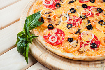 Assorted Pizza on the wooden background
