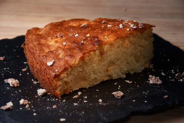 Delicious fresh baked piece of apple pie on shale board