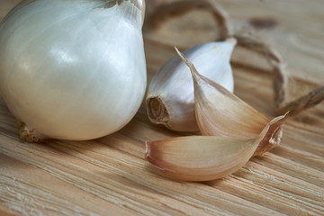 Bay leaf, onion and garlic on the wooden table top. Dry Spices Mix