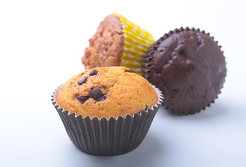 Assorted with Delicious homemade cupcakes with raisins and chocolate isolated on white background. Muffins. Top view.