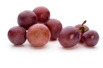 Ripe red grape isolated on white.