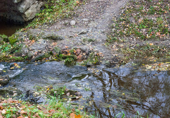 Water splashing over the rocks in the park