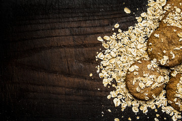 Obraz na płótnie Canvas cookies oat flakes board wood menu recipe ingredient